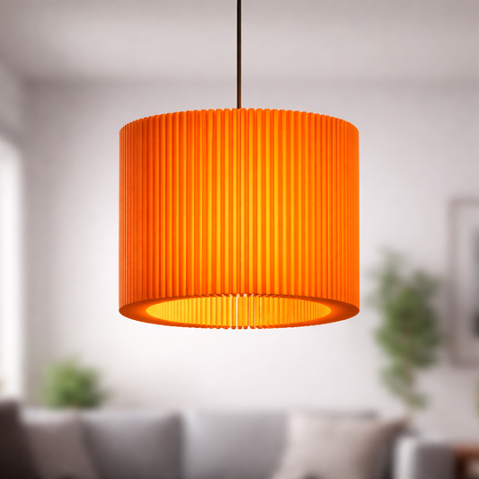 Orange pendant lamp hanging in a room with blurred background