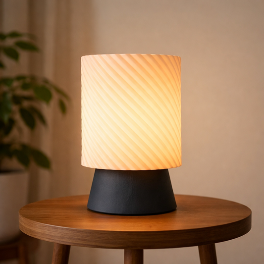 Table lamp with a textured shade on a wooden table against a neutral background