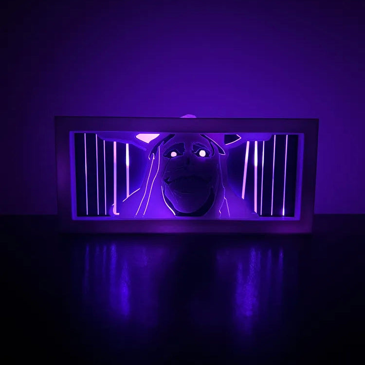 Dark room with a glowing purple light on a black surface