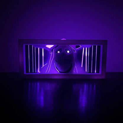 Dark room with a glowing purple light on a black surface