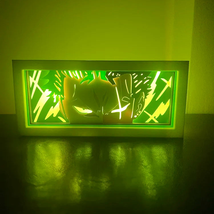 Rectangular light fixture with green glow on a dark surface