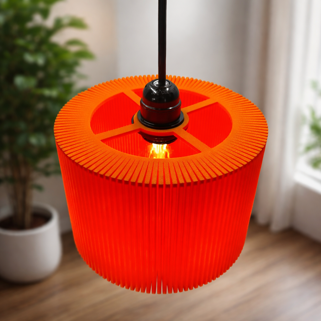 Orange pleated lampshade hanging in a room with plants and curtains.