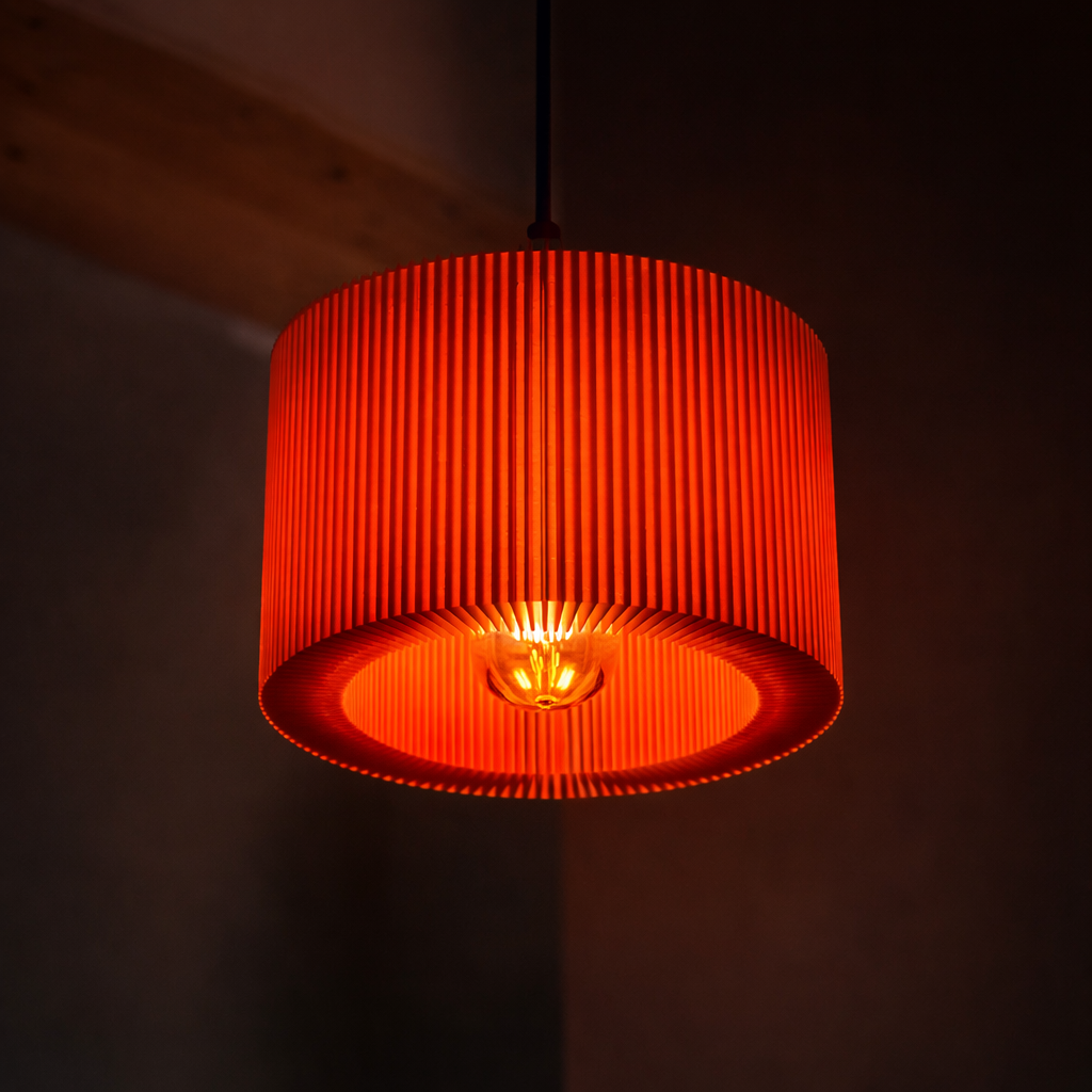Orange pendant light with a dark background