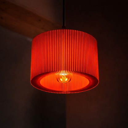 Orange pendant light with a dark background