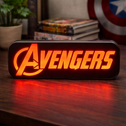 Avengers logo light on a wooden surface with comic books and a shield in the background