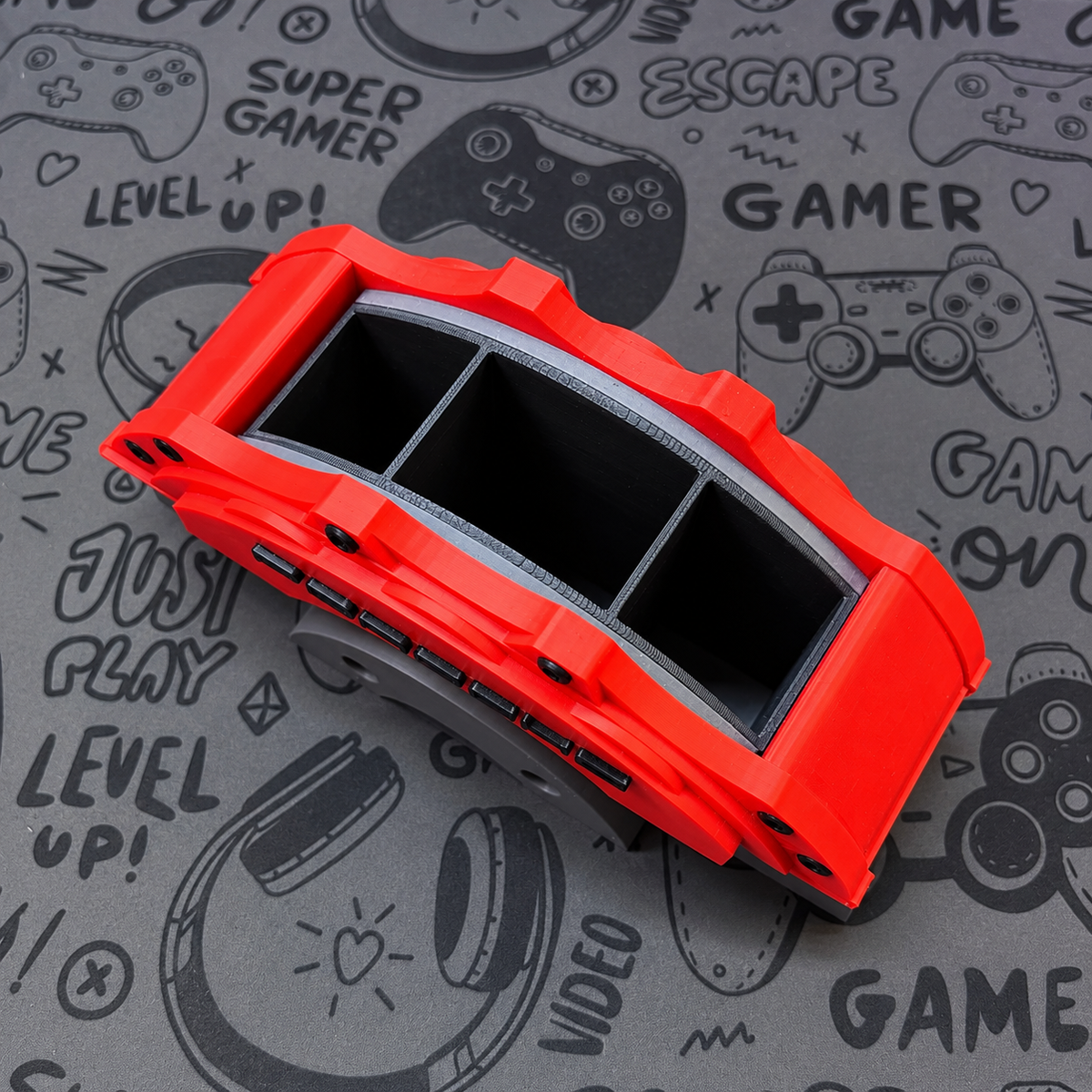 A bright red break caliper desk organiser top view image