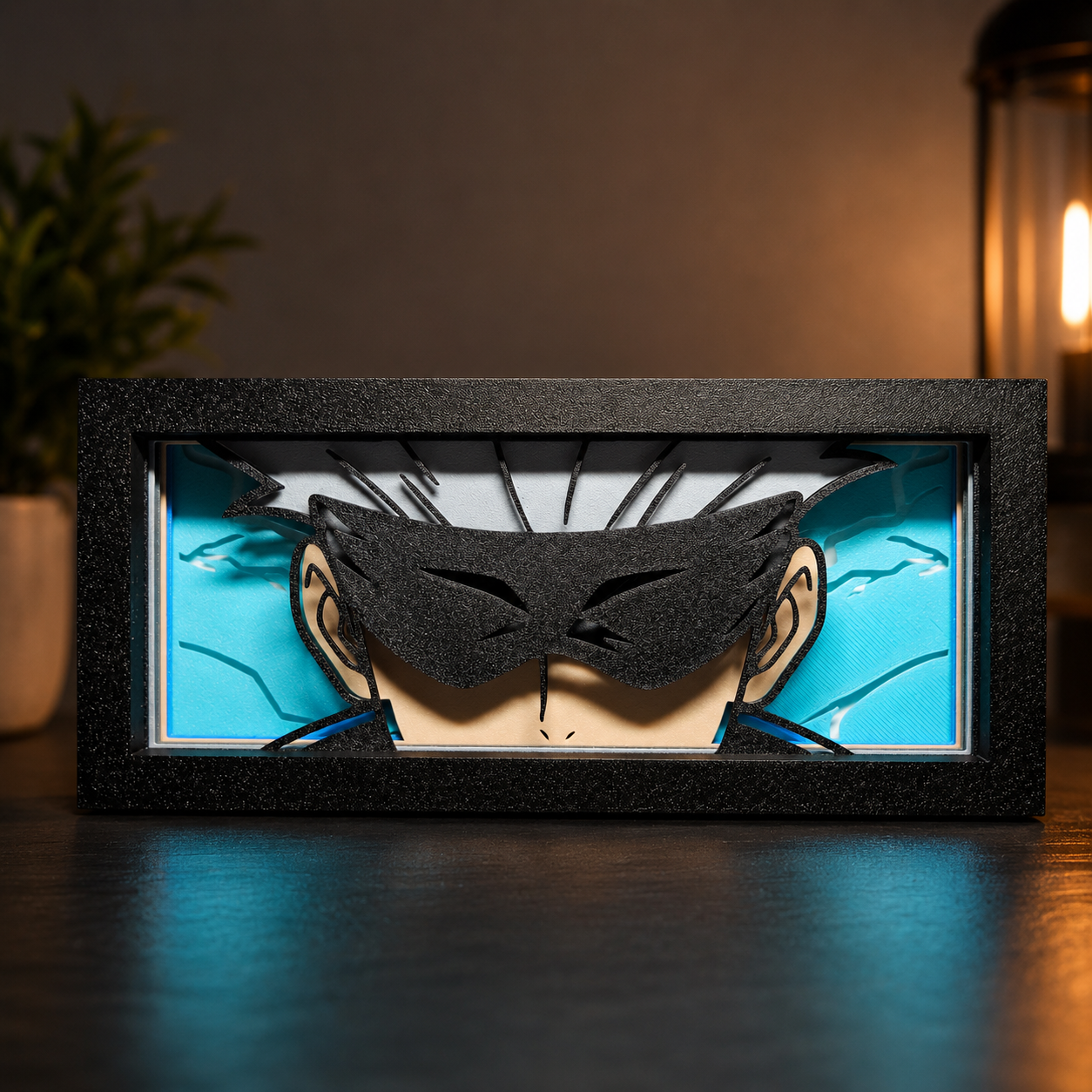 Framed artwork of a stylized face with black hair and eyes on a blue background.