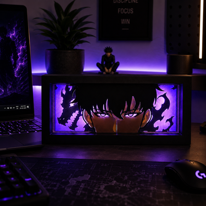 Desk setup with a laptop, keyboard, mouse, and decorative light box featuring anime design.