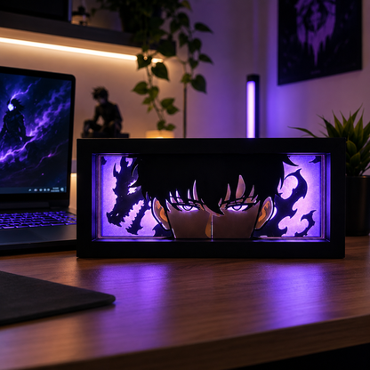 Anime-themed light box on a desk with a laptop in the background