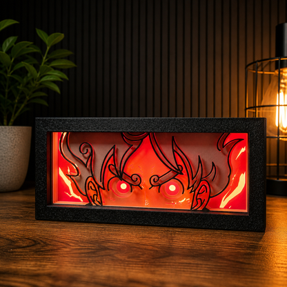 Decorative light box with dragon design on a wooden surface.