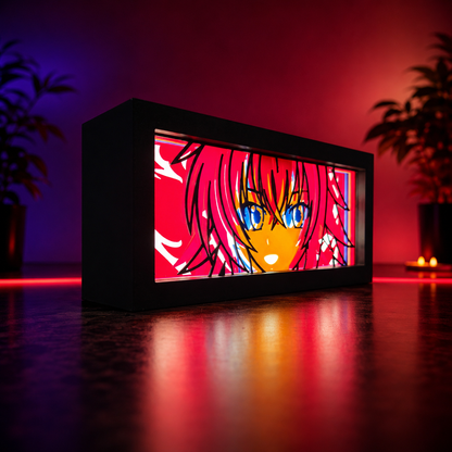 Anime character light box with red and black frame on a reflective surface with plants in the background