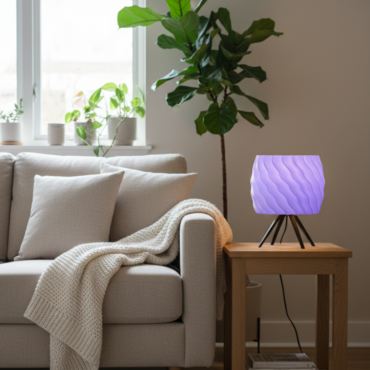 Living room with a beige sofa, a small wooden table with a purple lamp, and a plant in the background.