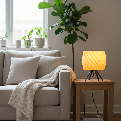 Cozy living room with a beige sofa, lamp, and plants
