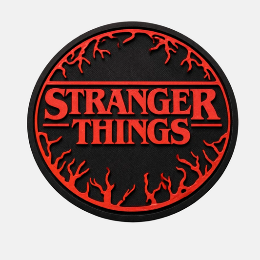 Round 'Stranger Things' logo patch with red text on a black background