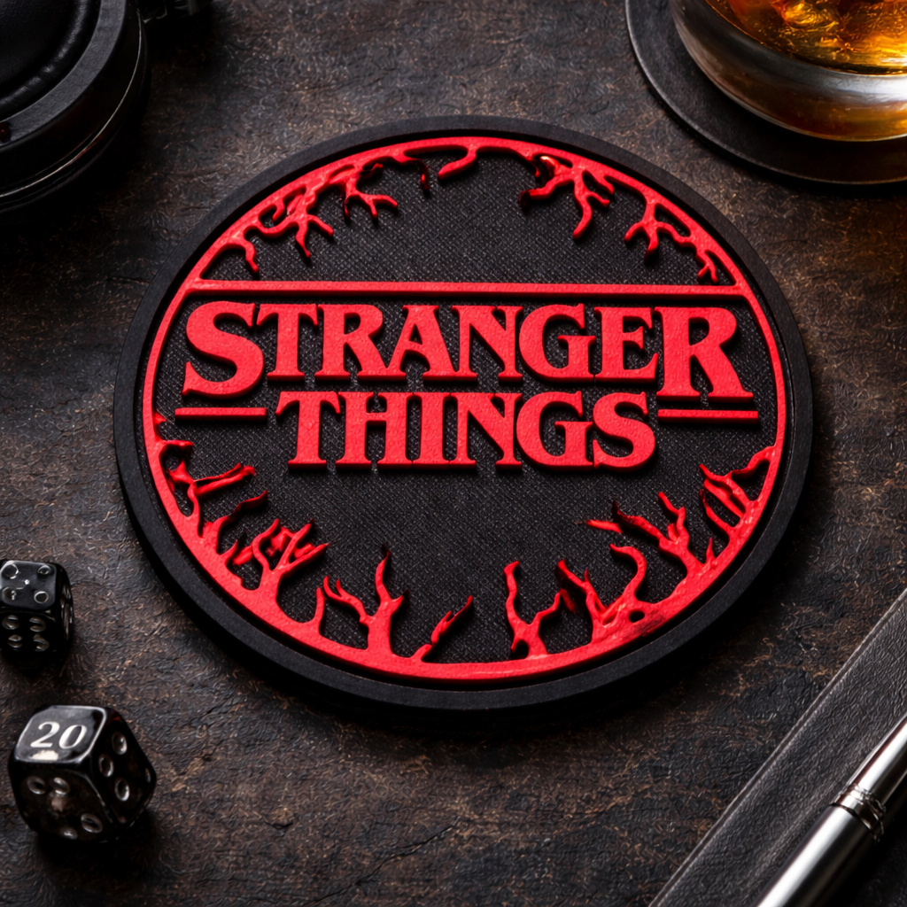 Coaster with 'Stranger Things' design on a dark surface with dice and a pen.