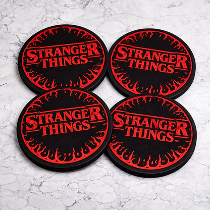 Four 'Stranger Things' coasters with red text on black background