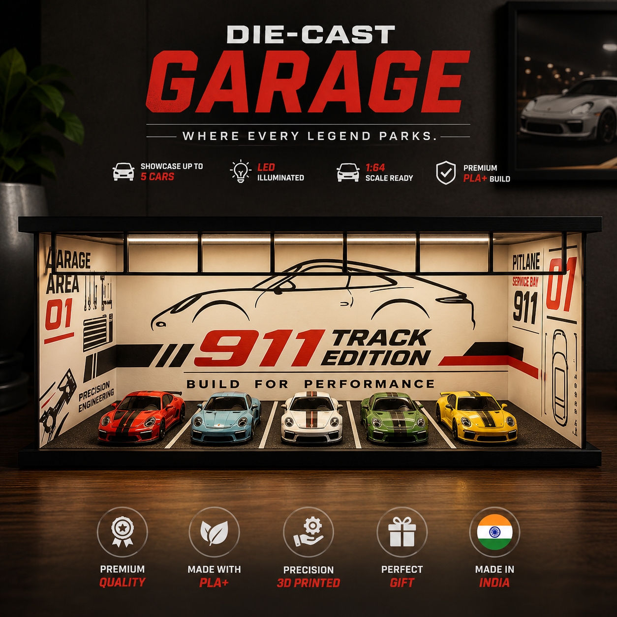 A die-cast garage display case featuring five miniature sports cars parked in simulated parking spots. The case has a black frame and a beige interior with '911 Track Edition' graphics, set against a dark garage-themed background with promotional text and feature icons.