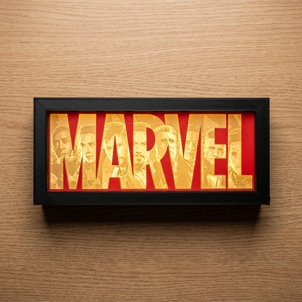 Marvel logo with character faces in a black frame on a wooden background