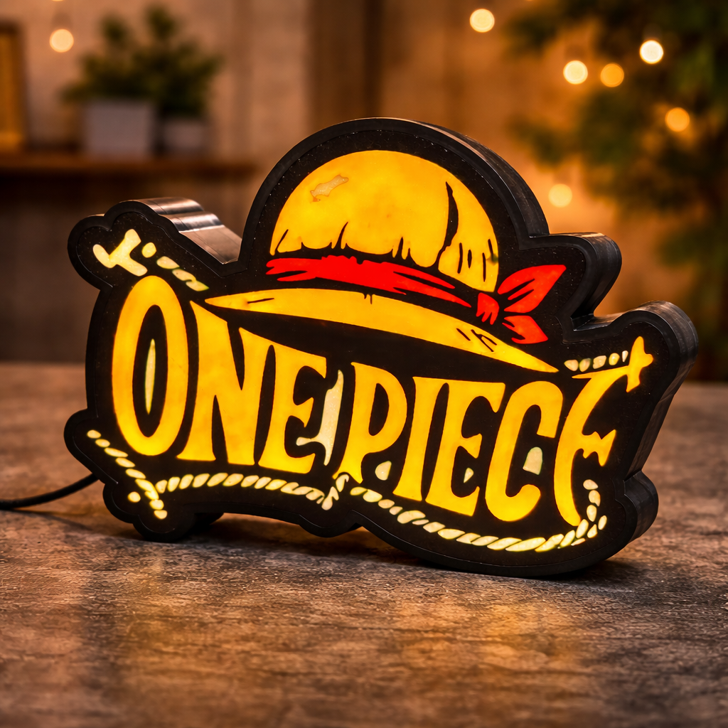 Decorative light with 'One Piece' logo on a wooden surface