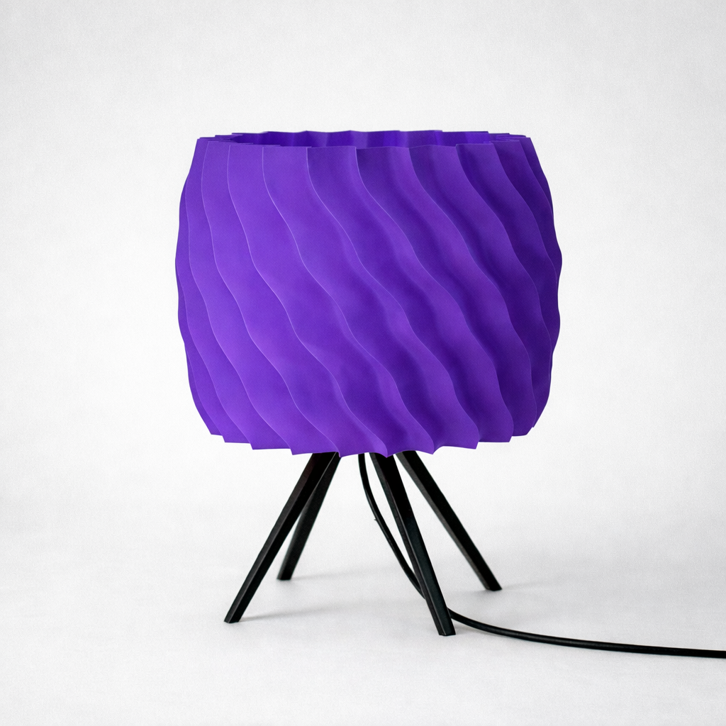 Purple textured lamp with black base on a white background