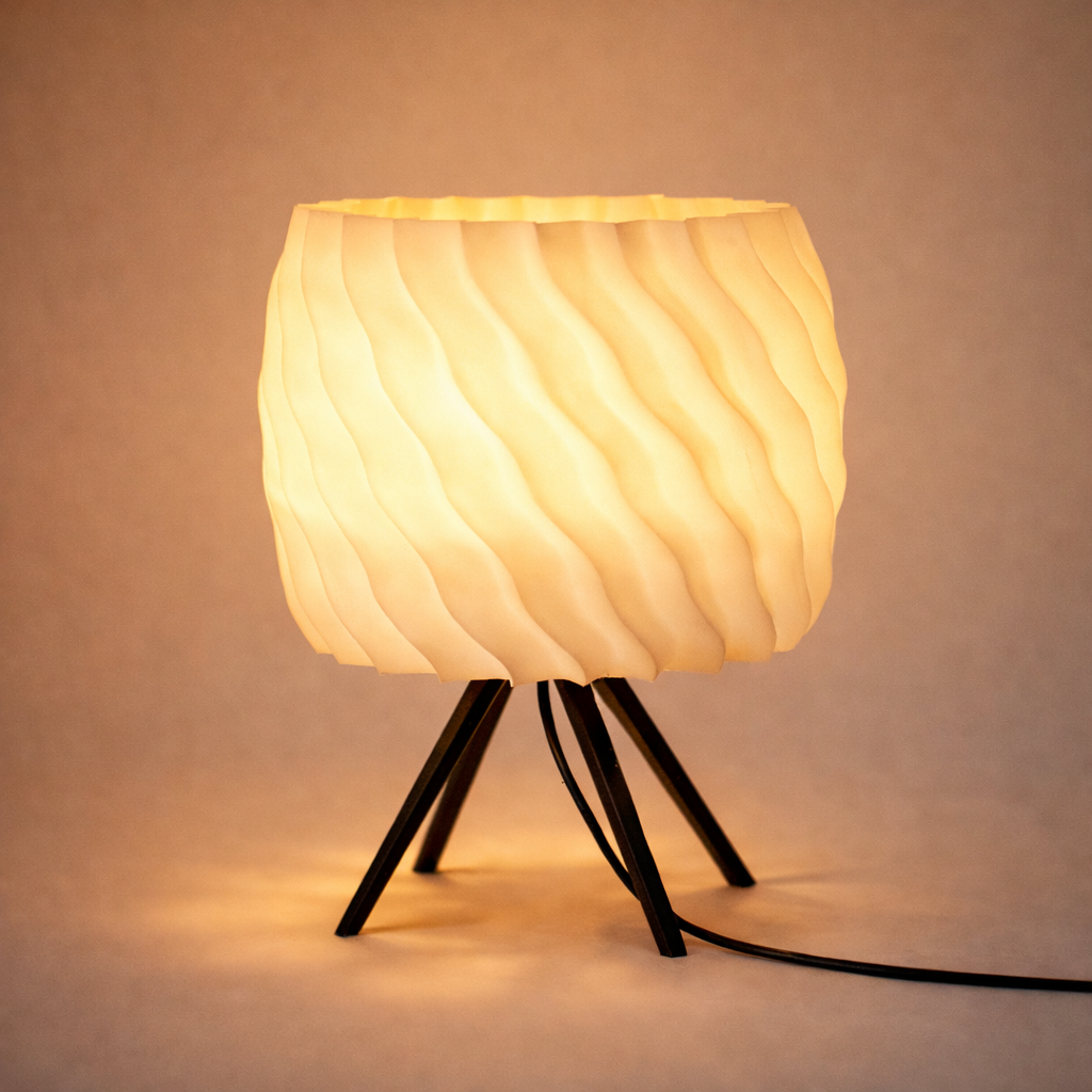 Small lamp with a textured white shade and black metal legs on a beige background
