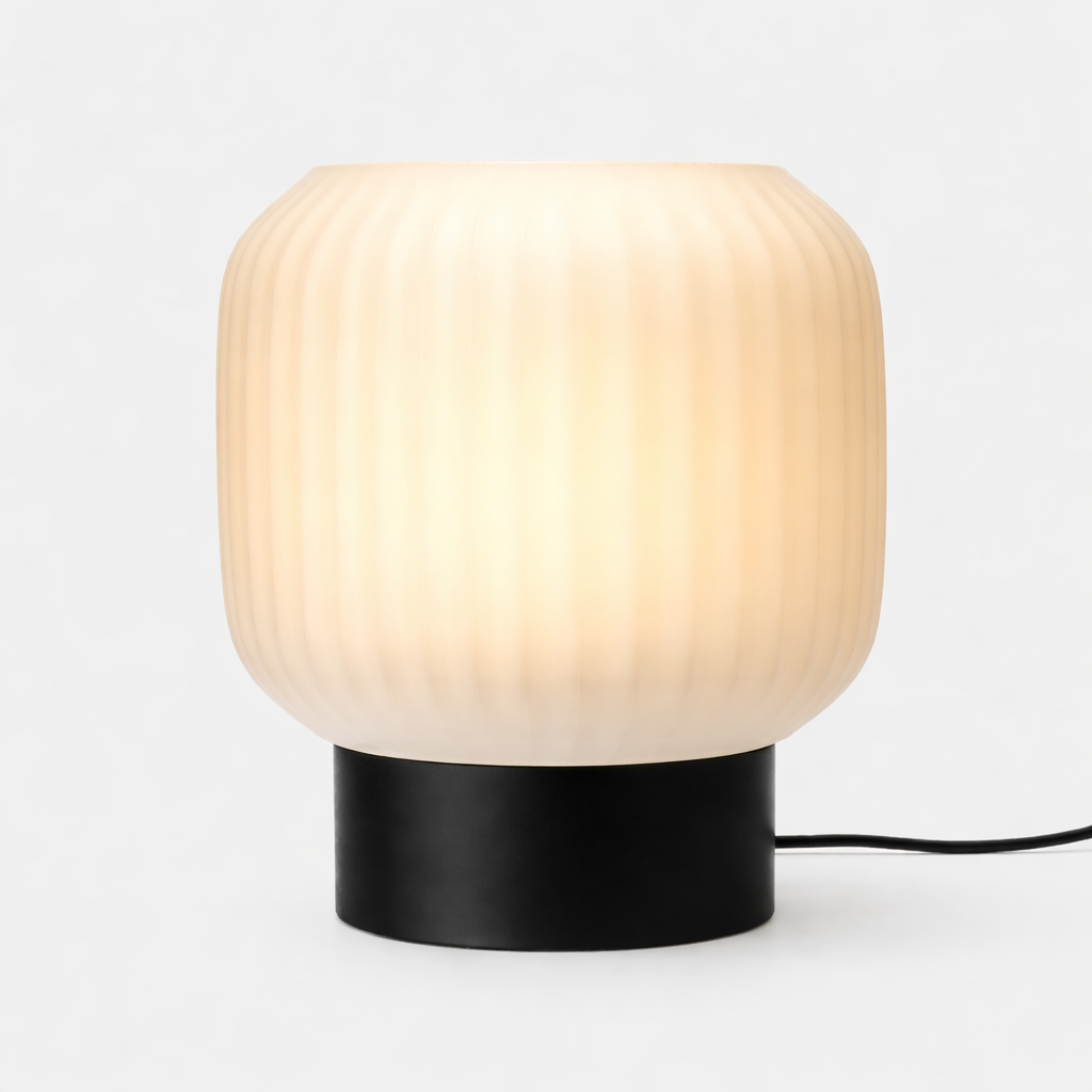 Table lamp with wooden shade and black base on a white background