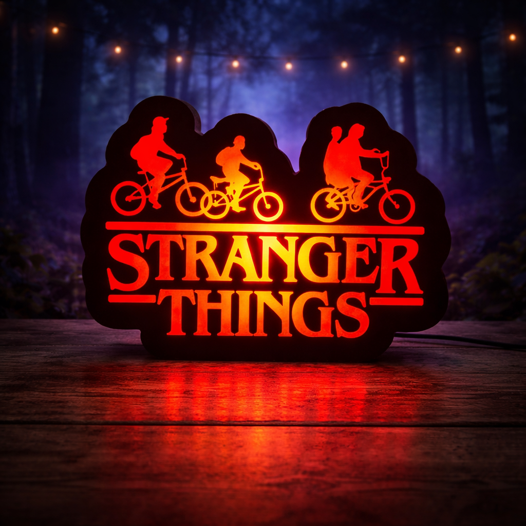 Decorative sign with 'Stranger Things' theme featuring silhouettes of characters on bikes against a dark background.