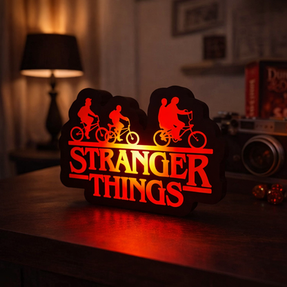 Decorative sign with 'Stranger Things' theme on a table