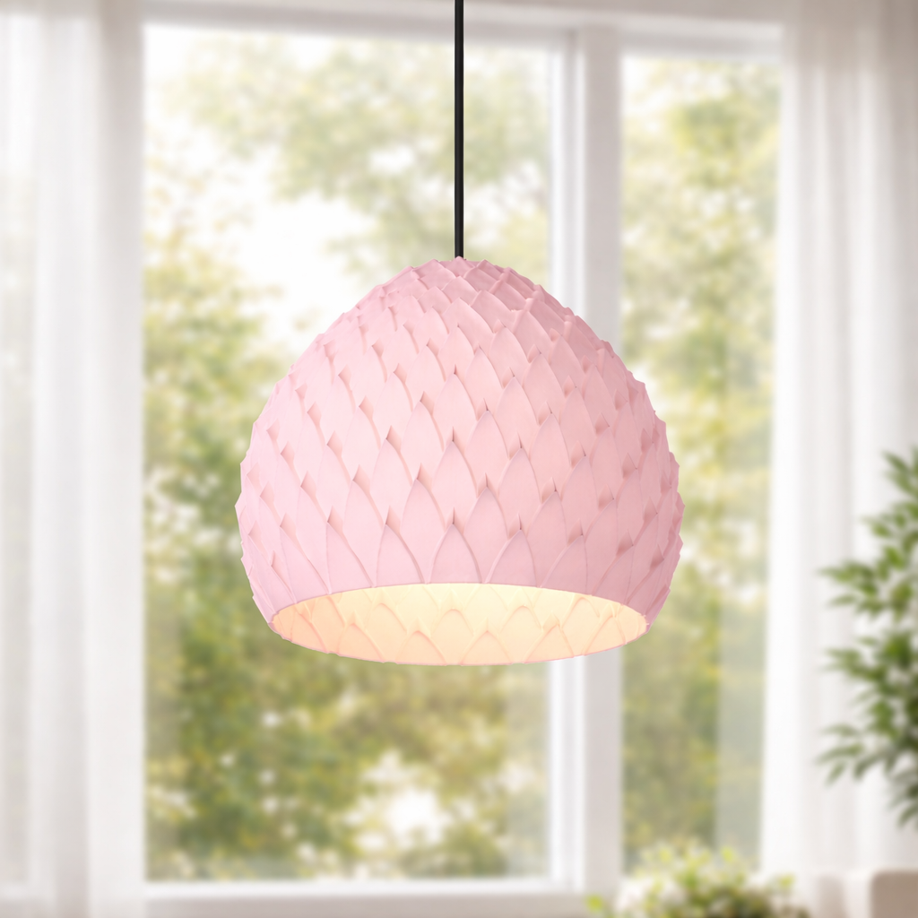 Pink woven pendant light hanging in front of a window with natural light.