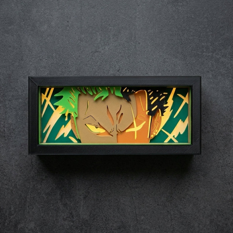 Framed artwork of a stylized face with green and orange colors on a dark gray background